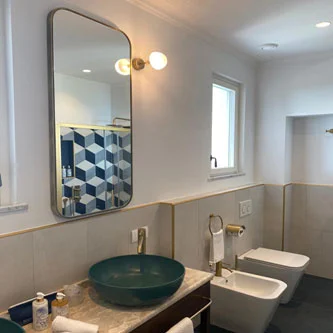 Miroir avec finition bronze  - POLLUCE